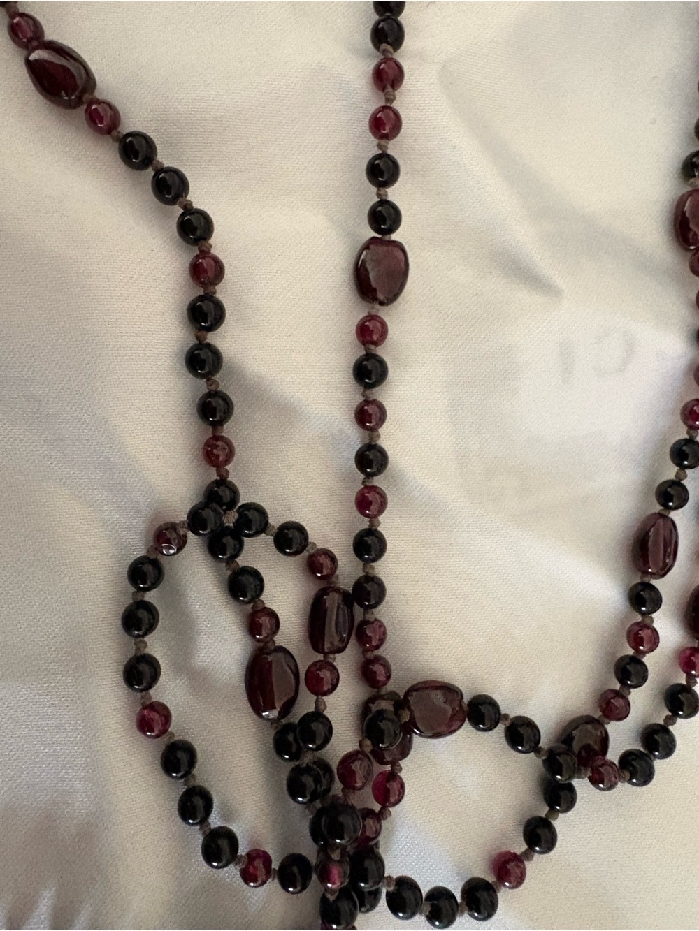 Beautiful Garnet and Black Onyx knotted beaded necklace 66 inches